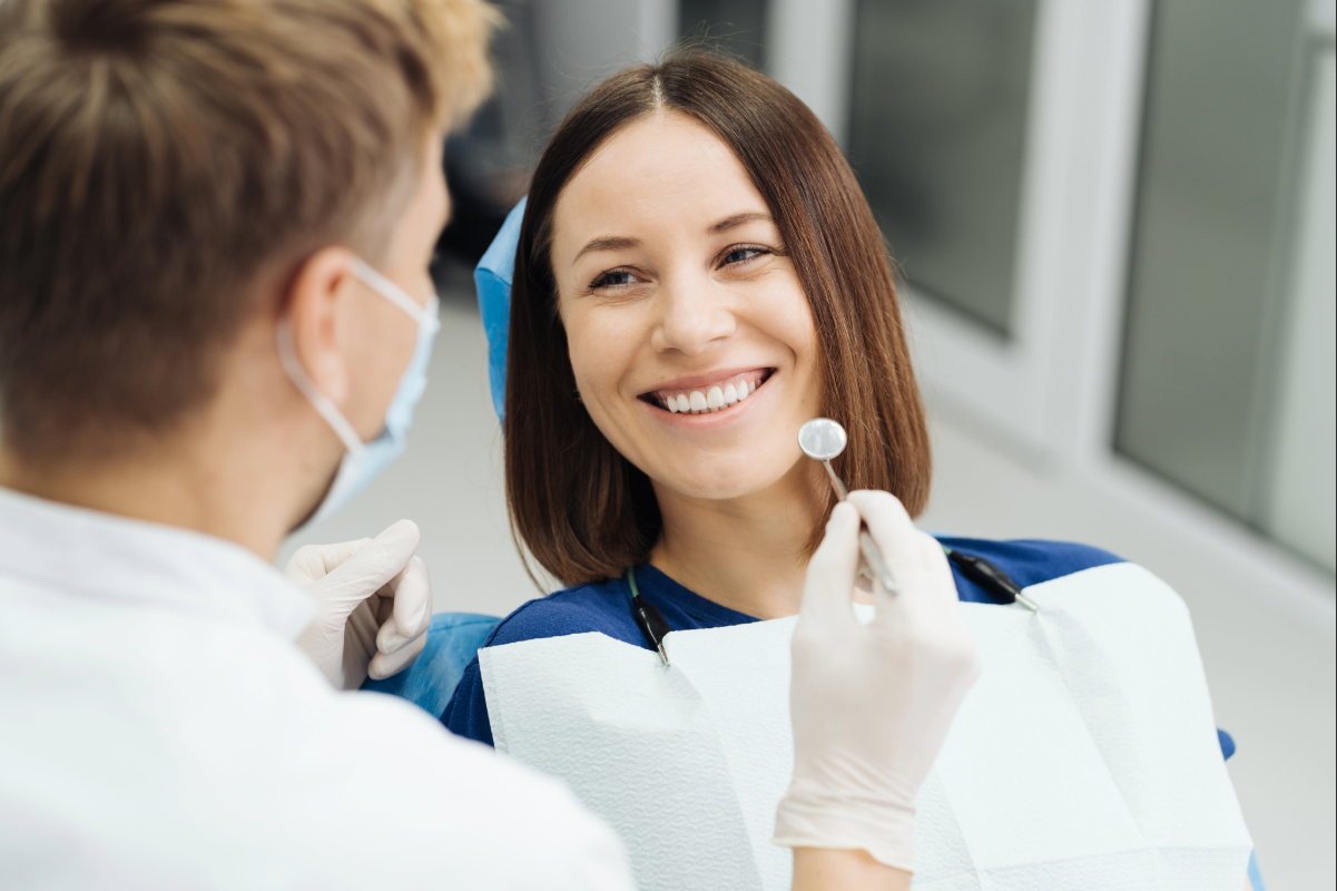 male-professional-dentist-with-gloves-mask-discuss-what-treatment-will-look-like-patient-s-teeth (1)